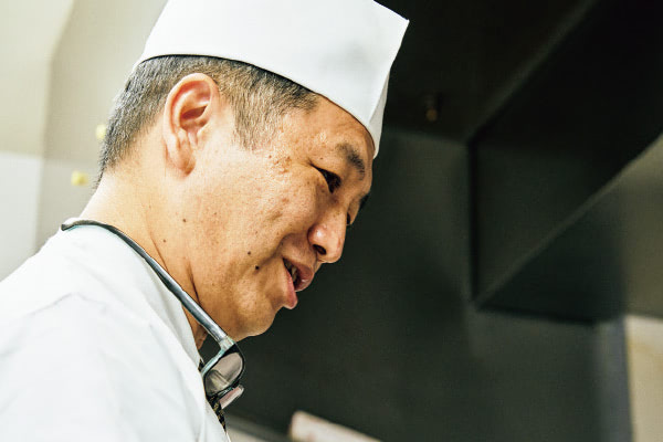 Portrait of the chef at the production line