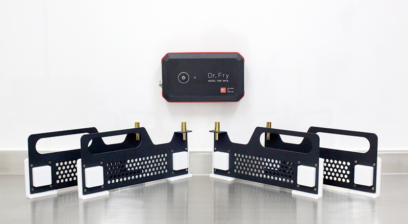 Dr. Fry control unit and four electrode panels on a stainless counter